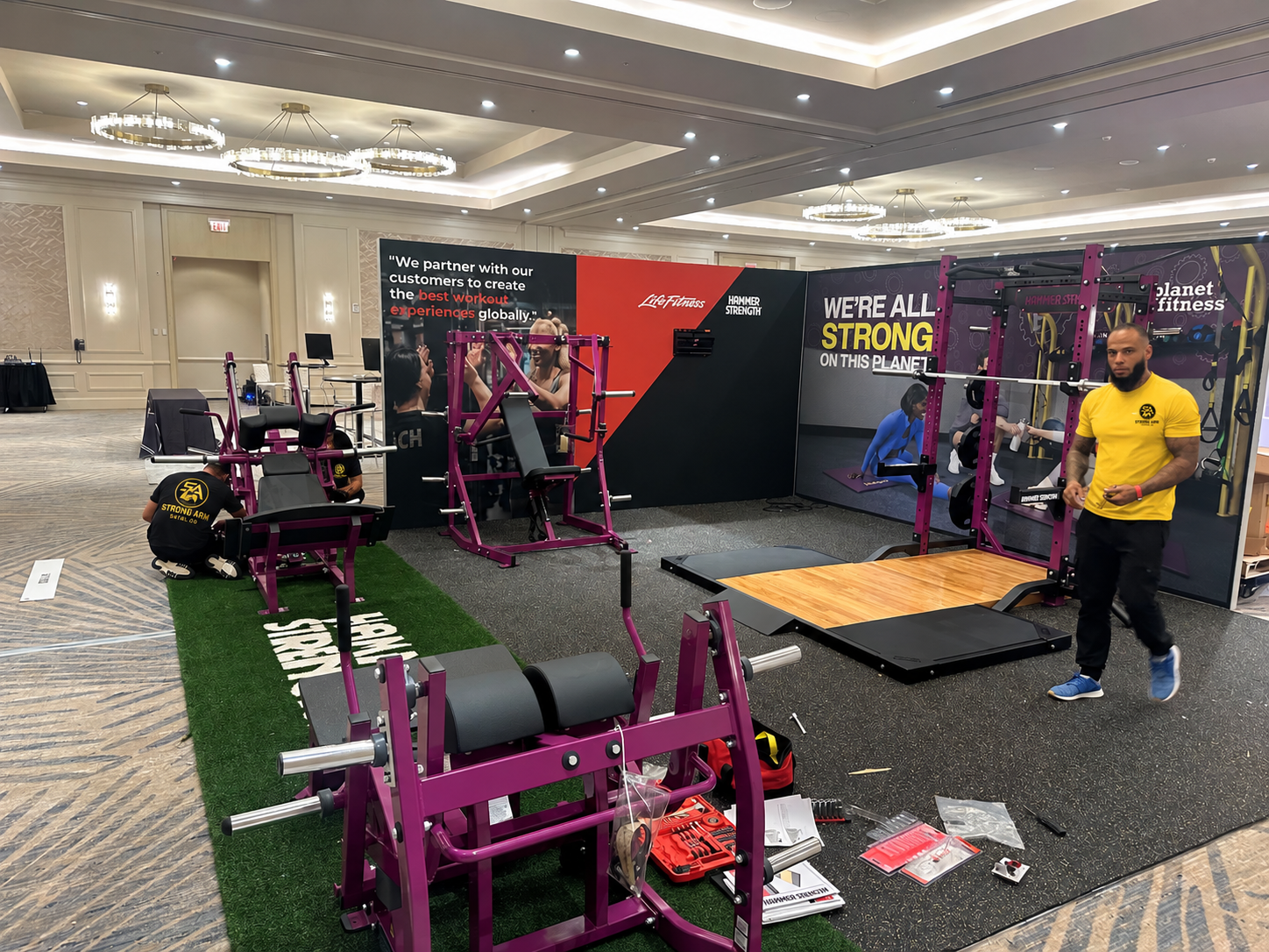 StrongArm crew building out Planet Fitness trade show floor