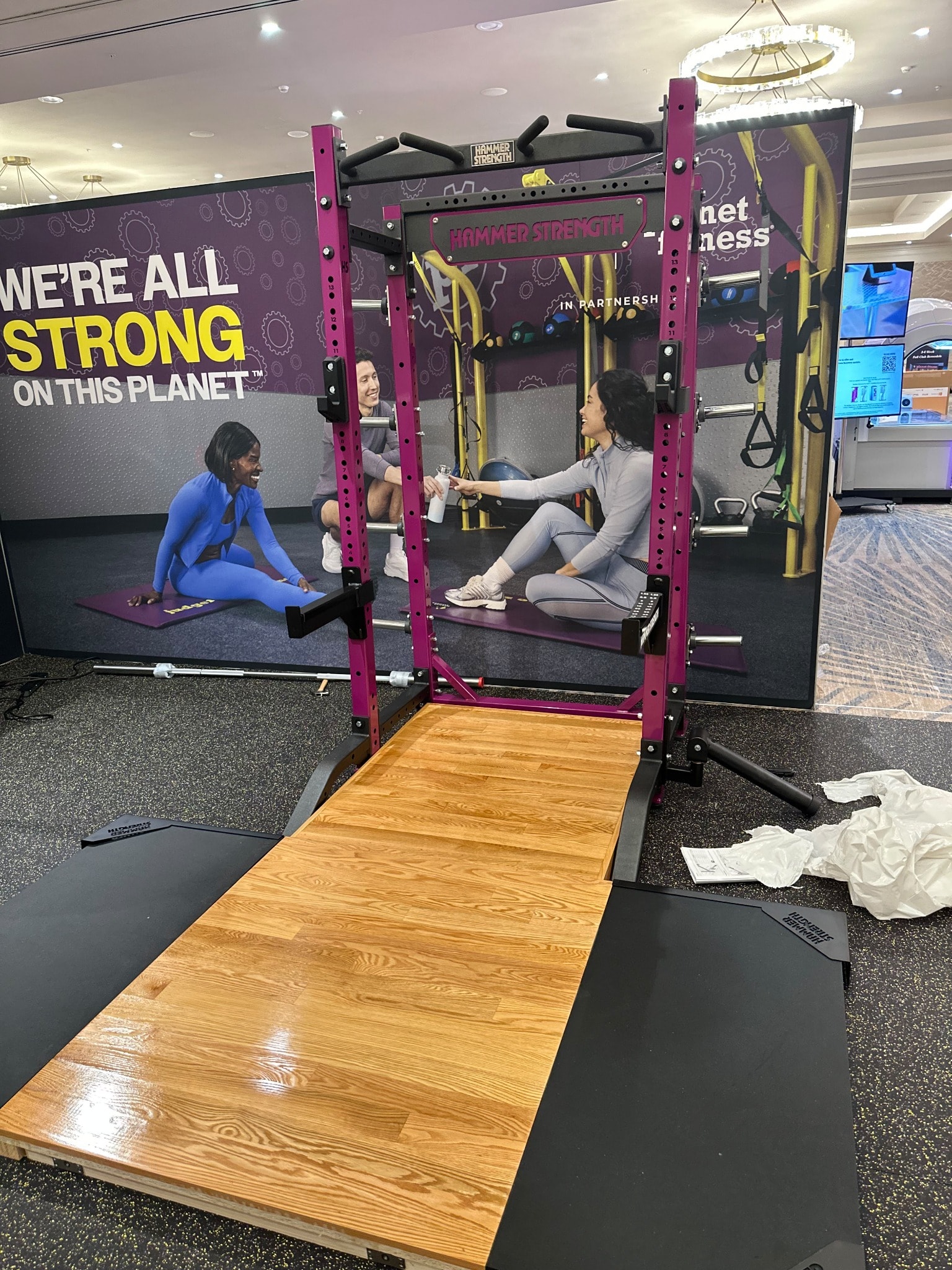 Hammer Strength rack assembly at Planet Fitness convention